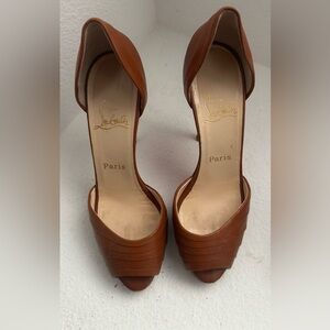 Louboutin heels in natural brown